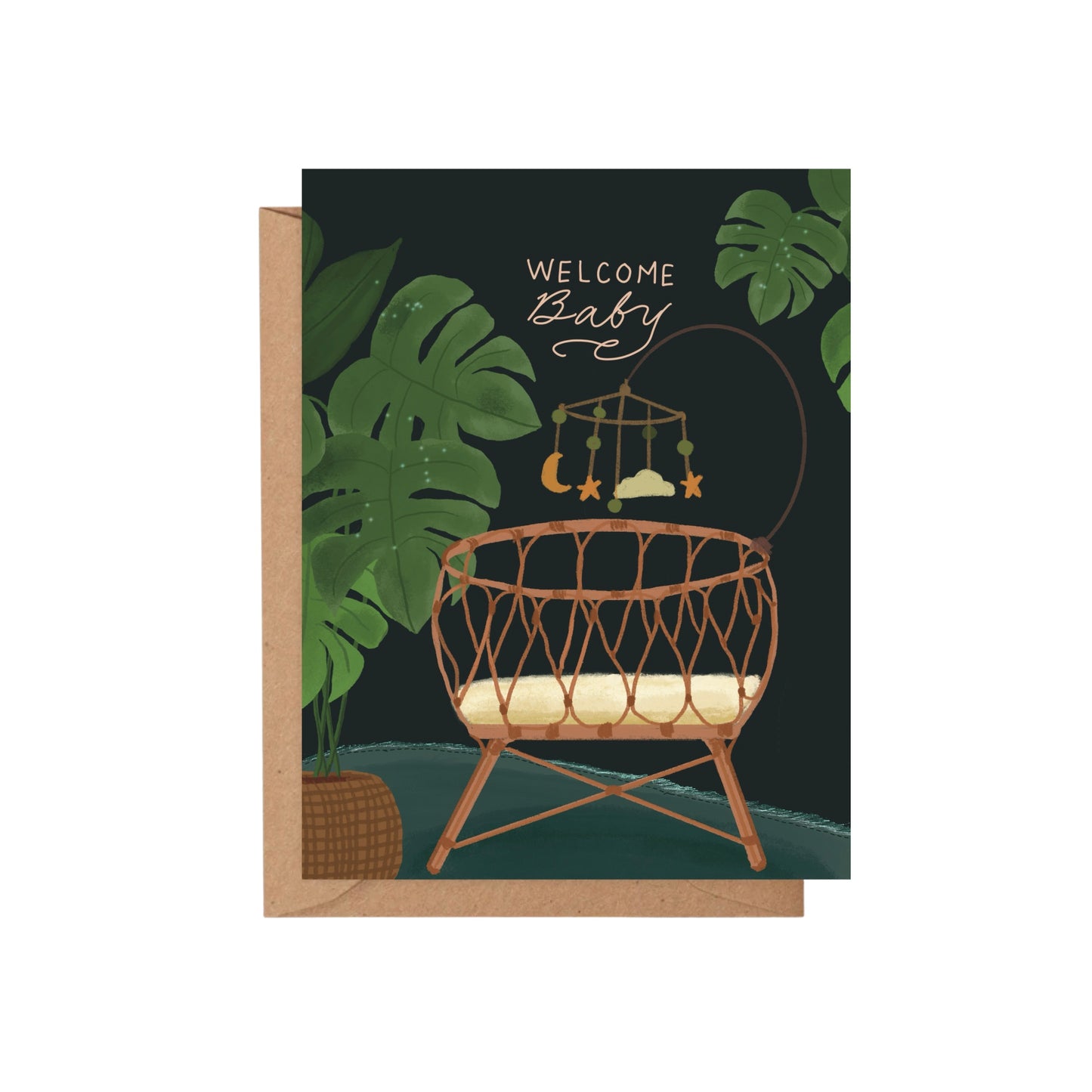 Welcome Baby greeting card featuring a wicker bassinet, nursery mobile, and tropical monstera leaves on a dark green background.