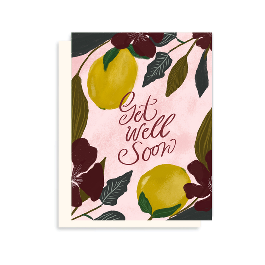 Greeting card with lemons and flowers on a pink background with 'Get Well Soon' text.